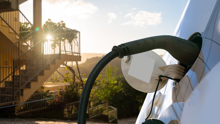 Electric car charging inlet with connected cable